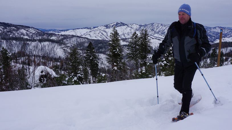 Scott Williams snowshoes along a ridge on his way to Stargaze Point north of Idaho City. The hike offers 360-degree mountain views. (Chadd Cripe/The Idaho Statesman/TNS)