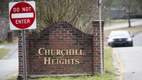A police officer blocks a road near an entrance to the Churchill Heights neighborhood Thursday, Feb. 13, 2020, in Cayce, S.C., where 6-year-old Faye Marie Swetlik recently went missing just after getting off a school bus. Hundreds of officers in Cayce, along with state police and FBI agents, are working around the clock to try to find Swetlik, who was last seen Monday, Cayce Public Safety Officer Sgt. Evan Antley reiterated Thursday. (AP Photo/Sean Rayford)