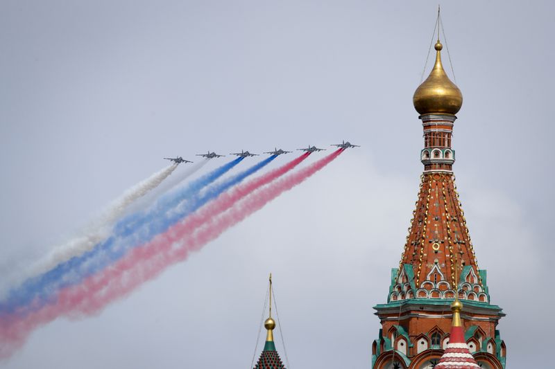 Russian Air Force Su-25 jets fly over Red Square leaving trails of smoke in the colours of the Russian national flag during the Victory Day military parade in Moscow, Russia, Thursday, May 9, 2024, marking the 79th anniversary of the end of World War II. (AP Photo)