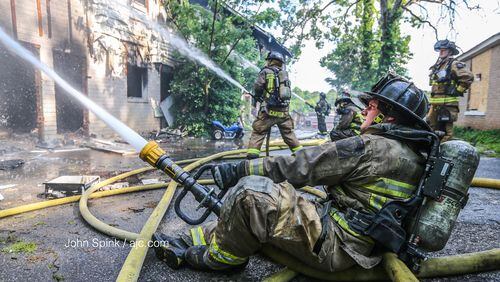 Atlanta fire crews work to extinguish a blaze at a vacant apartment complex.