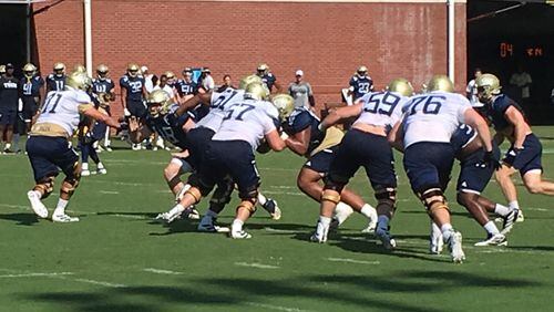The Georgia Tech offensive line at practice August 9, 2019 at Alexander Rose Bowl Field. (AJC photo by Ken Sugiura)