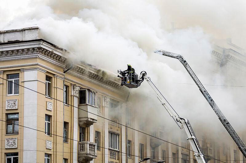 In this photo provided by the Dnipropetrovsk Regional Military Administration, rescuers work on the scene of a building damaged after a Russian attack in Dnipro, Ukraine, Friday, April 19, 2024. (Dnipropetrovsk Regional Military Administration via AP Photo)