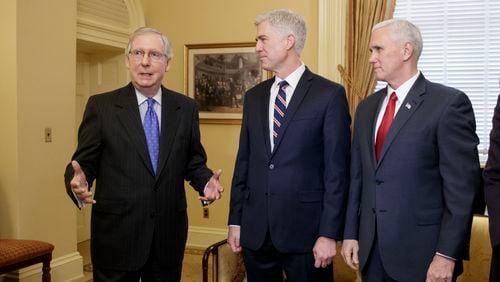 Supreme Court Justice nominee, Neil Gorsuch, center, is joined by Vice President Mike Pence, right, as they meet with Senate Majority Leader Mitch McConnell of Ky. on Capitol Hill in Washington, Wednesday, Feb. 1, 2017. Last year, Senate Republicans, led by McConnell, blocked a confirmation hearing for Judge Merrick Garland, President Barack Obama's pick for the vacancy left by the death of Justice Antonin Scalia who died in February 2016. (AP Photo/J. Scott Applewhite)