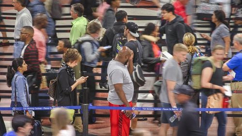 Security lines were excruciatingly long at Hartsfield-Jackson International Airport as the Memorial Day weekend commenced. JOHN SPINK / JSPINK@AJC.COM