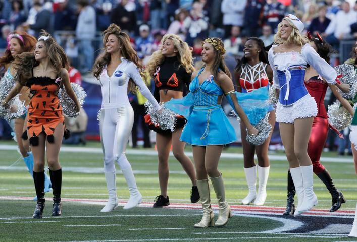 Cheerleaders take to the field in costumes