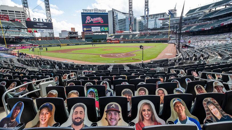 Cut-out fans located behind home base have been adjusted in their seats to prevent glare on the players against the Boston Red Sox Sunday, Sept. 27, 2020, at Truist Park in Atlanta.  (Alyssa Pointer / Alyssa.Pointer@ajc.com)