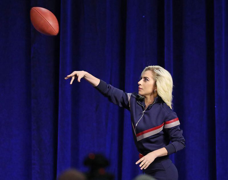  Lady Gaga throws her official game ball football the her father in the crowd during the Super Bowl Halftime Show Press Conference Thursday, Feb. s, 2017, in Houston. (Curtis Compton/ccompton@ajc.com)