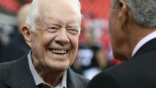 October 23, 2016 Atlanta: Jimmy Carter shares a laugh with Falcons owner Arthur Blank before playing the Chargers in an NFL football game on Sunday, Oct. 23, 2016, in Atlanta. Carter was on hand for the coin toss, just one more instance of the former president and Georgia governor packed schedule of undertakings and newsmaking in 2016. Curtis Compton /ccompton@ajc.com