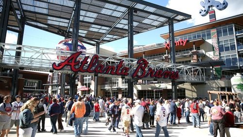 Fans head into SunTrust Park for the Braves-Yankees exhibition game Friday night. JASON GETZ / SPECIAL