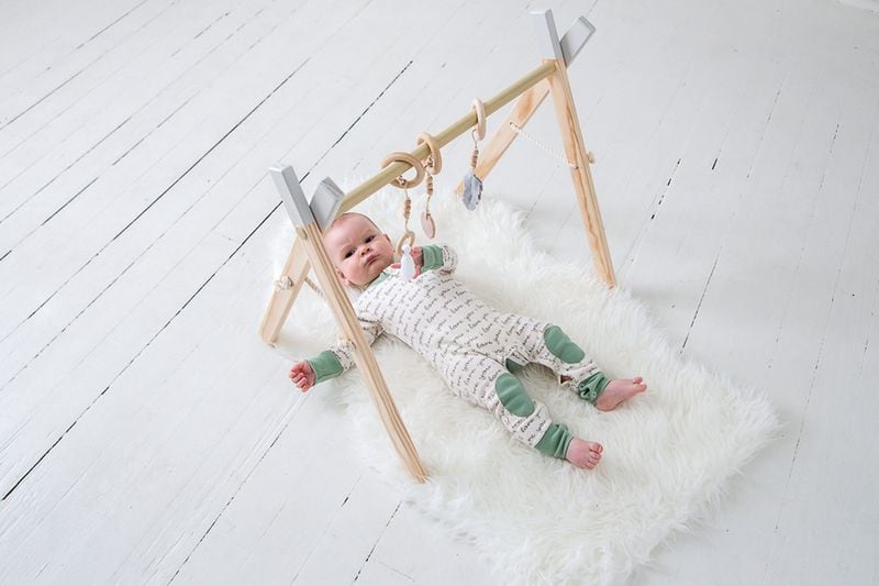 Marietta-based Clover and Birch creates modern wooden toys, including its best-selling activity gym for babies. Contributed by cloverandbirch.com