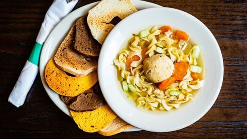 Chicken noodle soup with a matzo ball and bagel chips at Goldbergs Fine Foods. CONTRIBUTED BY HENRI HOLLIS