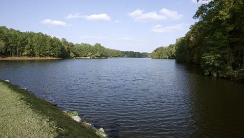 Martin’s Lake is a 46-acre body of water that’s the centerpiece of the Martin’s Landing community in Roswell. The city has agreed to pay the Martin’s Landing Foundation $500,000 to settle a dispute over upkeep of the lake. AJC FILE