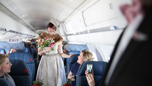 Ken Nilsen proposed to his girlfriend, Tracy Bellman, on a trip to Paris. They got married on a recent Delta flight. Contributed by Delta. Photos taken by Sherri Barber