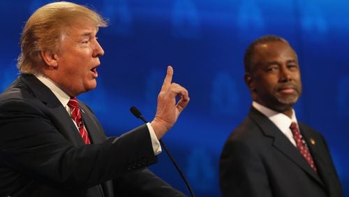 BOULDER, CO - OCTOBER 28: Presidential candidates Donald Trump (L) speaks while Ben Carson looks on during the CNBC Republican Presidential Debate at University of Colorados Coors Events Center October 28, 2015 in Boulder, Colorado. Fourteen Republican presidential candidates are participating in the third set of Republican presidential debates. (Photo by Justin Sullivan/Getty Images)