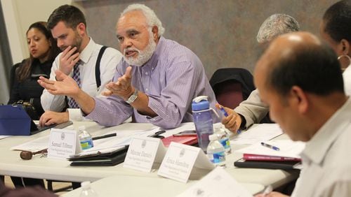 Samuel Tillman, chairman for the DeKalb County Elections Board, talks to voters about the possibilities for early voting sites on April 24, 2017. (HENRY TAYLOR / HENRY.TAYLOR@AJC.COM)