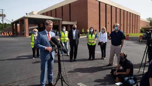 Speaking with the press Friday after touring a COVID-19 testing site at the Lilburn First Baptist Church in Gwinnett County, Gov. Brian Kemp said he did not see enough public buy-in to institute a statewide requirement to wear masks to fight the spread of the disease. (PHOTO by Steve Schaefer for the AJC)