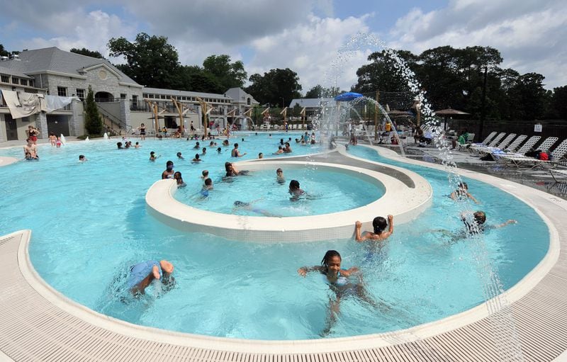 The Piedmont Pool features lap lanes, a shallow wading section and a channel for floating. With almost 50,000 people swimming in this intown pool from Memorial Day until Labor Day each season, expect a crowded spot for sunbathers and swimmers, especially on sunny weekend days. FILE PHOTO BY BRANT SANDERLIN /BSANDERLIN@AJC.COM