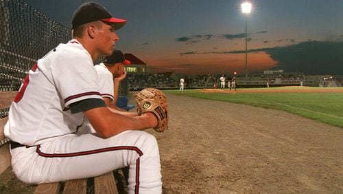 Braves' Patrick Schmidt watches the second game of an Aug. 10, 1998, double-header against the Burlington Indians from the bullpen bench. (BEN GRAY/AJC)