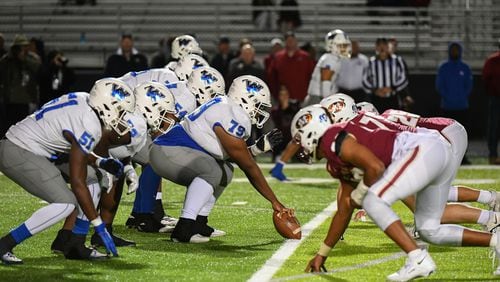 Both teams line up on the line of scrimmage during the Westlake vs. Mill Creek High School Football game on Friday, Nov. 25, 2022, at Mill Creek High School in Hoschton, Georgia. (Jamie Spaar for the Atlanta Journal Constitution)