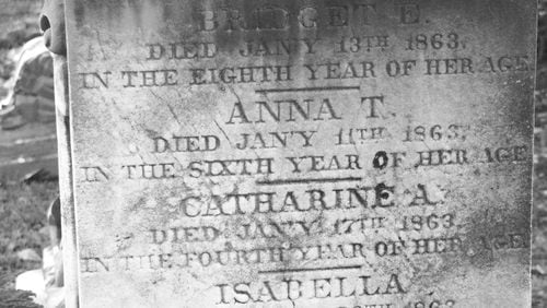 Tombstone at Historic Oakland Cemetery bears the names of four children killed by diphtheria.