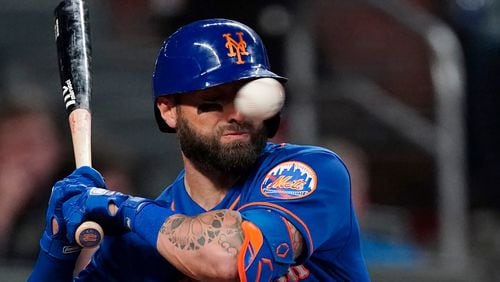 Mets' Kevin Pillar is hit in the face with a pitch from Braves reliever Jacob Webb in the seventh inning Monday, May 17, 2021, at Truist Park in Atlanta.