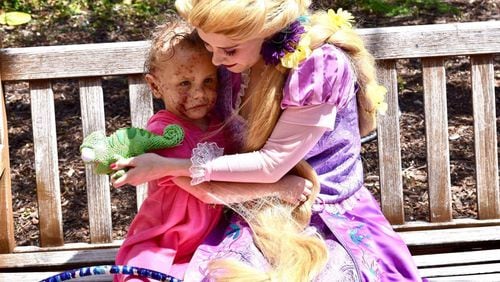 Kadence Johnson meets the Princess Rapunzel character at Scottish Rite. (Family photo)