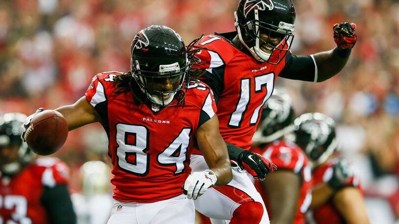 Roddy White #84 celebrates with Devin Hester #17 of the Atlanta Falcons after a touchdown catch in the first half against the New Orleans Saints at the Georgia Dome on September 7, 2014 in Atlanta, Georgia.