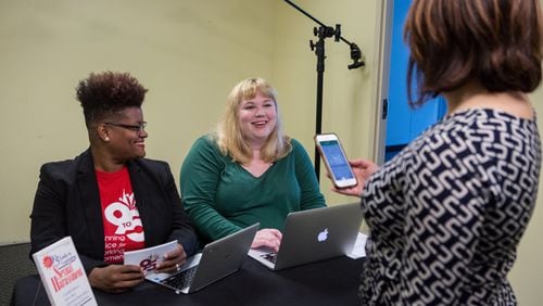 (left to right)9to5 state director Erica Clemmon (from left) and Atlanta Women of Equality executive director Lisa Anderson talk with 9to5 senior communications coordinator Casie Yoder as they prepare to speak about sexual harassment and the me too movement before a Facebook Live event hosted by the nonprofit 9to5 at their offices in Atlanta on Wednesday November 1st, 2017. (Photo by Phil Skinner)