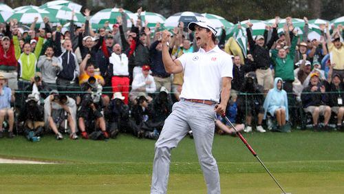 Adam Scott screamed "C'mon, Aussie!" after making made a 20-foot birdie putt on the 18th hole for a 3-under 69 to take a one-shot lead in the final round.