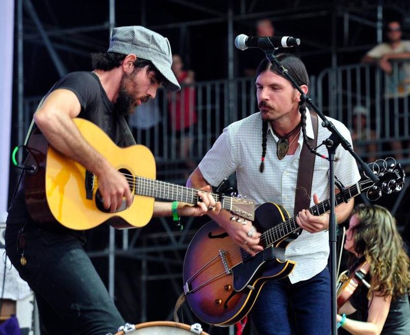Seth and Scott Avett of the Avett Brothers get hot playing the final day of the Bonnaroo Music & Arts Festival on June 15, in Manchester, Tenn.
