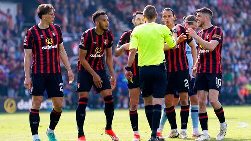 Bournemouth players appeal to referee Matt Donohue after he awards a penalty to Brentford A VAR check overturns the decision , during the English Premier League soccer match between Brentford and Bournemouth, at the Vitality Stadium, in Bournemouth, England, Saturday, May 11, 2024. (Andrew Matthews/PA via AP)