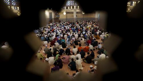 Muslims attend prayers at National Mosque for the Eid al-Fitr, marking the end the holy fasting month of Ramadan in Kuala Lumpur, Malaysia, Wednesday, April 10, 2024. (AP Photo/Vincent Thian)