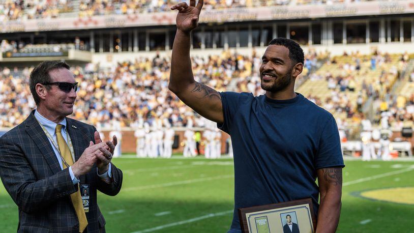 Former Georgia Tech All-American and 2009 ACC defensive player of the year Derrick Morgan acknowledges fans at halftime of Tech's game against North Carolina at Bobby Dodd Stadium Oct. 5, 2019. Morgan was inducted into Tech's sports hall of fame the previous night. (Danny Karnik/Georgia Tech Athletics)