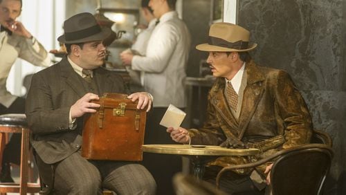 Josh Gad, left, and Johnny Depp star in “Murder on the Orient Express.” Contributed by Nicola Dove/Twentieth Century Fox via AP