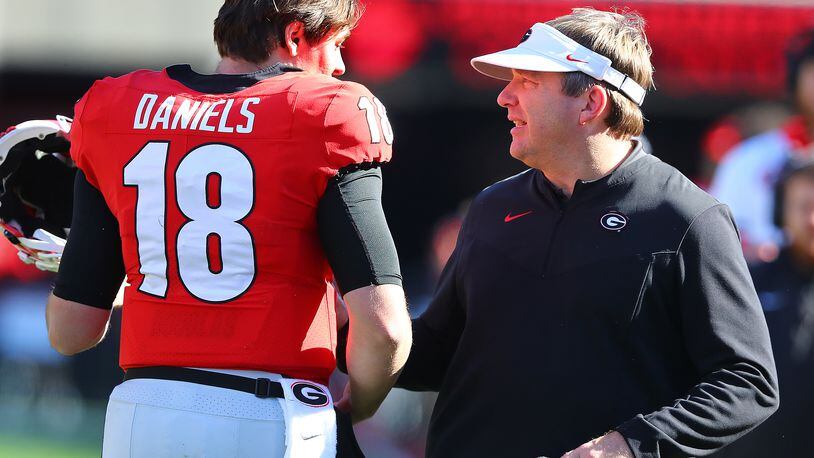 112021 Athens: Georgia head coach Kirby Smart and quarterback JT Daniels confer during the second quarter against Charleston Southern in a NCAA college football game on Saturday, Nov. 20, 2021, in Athens.    “Curtis Compton / Curtis.Compton@ajc.com”