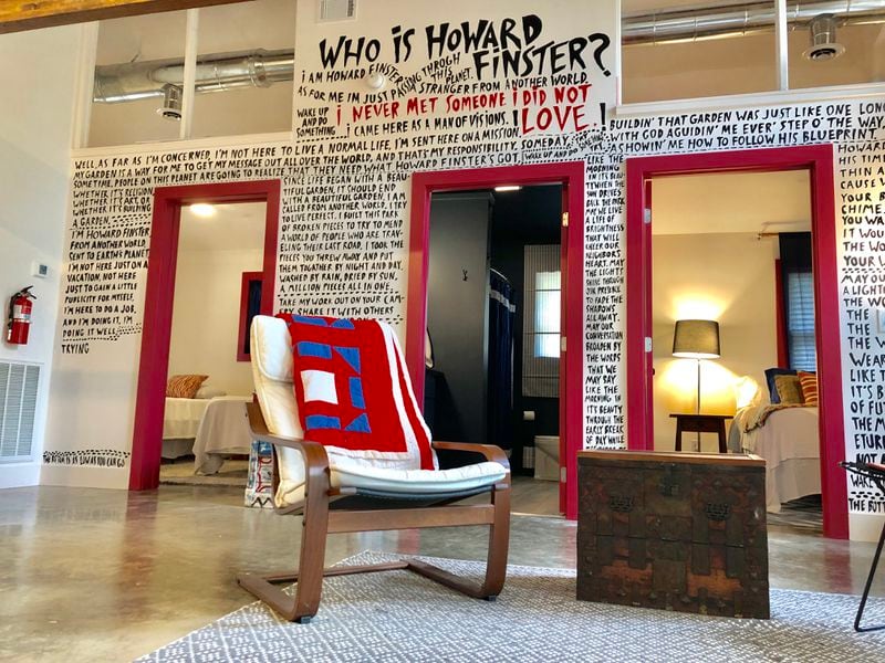 A photo of what's called the bungalow, one of three AirBnb places to stay at Paradise Garden, the four-acre creation of folk artist Howard Finster. The "Who is Howard Finster?" wall was conceived by Atlanta-based interior designer Summer Loftin and displays many of Finster's writings and musings. (Photo courtesy of Paradise Garden Foundation)
