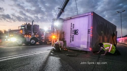 An overturned box truck on I-75 North at Central Avenue caused heavy delays between Clayton County and downtown Atlanta early Monday, authorities said.