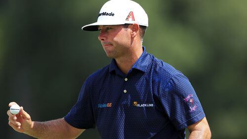 It's a satisfying day all around for Chez Reavie, who shot 64, the low round of Friday at East Lake. (Photo by Sam Greenwood/Getty Images)