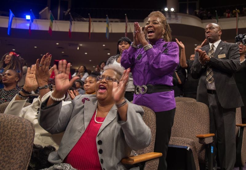 Marilyn Burnett cheered as Jamal Bryant delivered his first sermon as New Birth’s senior pastor. Experts said that Bryant’s celebrity status could be an asset to the church, which needs to increase tithes and offerings to gain financial stability. STEVE SCHAEFER / SPECIAL TO THE AJC