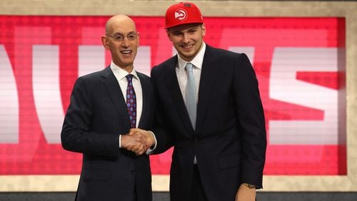 Luka Doncic poses with NBA Commissioner Adam Silver after being drafted third overall by the Atlanta Hawks during the 2018 NBA Draft at the Barclays Center on June 21, 2018 in the Brooklyn borough of New York City. He was then traded to the Dallas Mavericks.