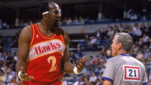 SEATTLE, WA - JANUARY 1: Moses Malone #2 of the Atlanta Hawks talks to a referee, during the NBA game against the Seattle SuperSonics at the Seattle Center in Seattle, Washington on January 1, 1989.
