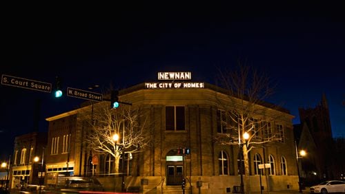 Caption: The City of Homes sign hangs from the top of the Newnan Carnegie Library building in downtown Newnan. Credit: City of Newnan