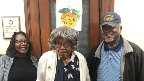 Ida Simmons, a 105-year-old woman from Attapulgus in southwest Georgia's Decatur County, cast her general election ballot in person as part of early voting on Oct. 24, 2022. Daughter-in-law Roberta Simmons (left) and son Simon Simmons (right), brought her to the elections office in Bainbridge. Ida Simmons first registered to vote in the summer of 1964 during a tumultuous era for civil rights and voting by Black people. (Photo courtesy of the Simmons family)