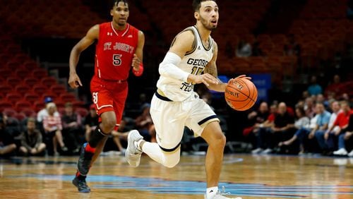 Jose Alvarado #10 of the Georgia Tech Yellow Jackets drives to the basket against Justin Simon #5 of the St. John's Red Storm during the HoopHall Miami Invitational at American Airlines Arena on December 1, 2018 in Miami, Florida.  (Photo by Michael Reaves/Getty Images)