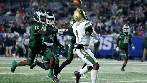 Dec. 30, 2020 - Atlanta, Ga: Grayson wide receiver Jamal Haynes (1) catches a touchdown pass from quarterback Jake Garcia (not pictured) against Collins Hill defensive back Travis Hunter (12) in the first half during the Class 7A state high school football final at Center Parc Stadium Wednesday, December 30, 2020 in Atlanta. JASON GETZ FOR THE ATLANTA JOURNAL-CONSTITUTION






