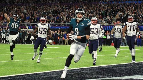 MINNEAPOLIS, MN - FEBRUARY 04:  Nick Foles #9 of the Philadelphia Eagles catches a 1-yard touchdown pass against the New England Patriots during the second quarter in Super Bowl LII at U.S. Bank Stadium on February 4, 2018 in Minneapolis, Minnesota.  (Photo by Mike Ehrmann/Getty Images)
