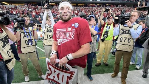 Oklahoma Sooners quarterback Baker Mayfield (6) puts on a OU Big 12 Champion t-shirt after the game as Oklahoma beat TCU 41-17 in the Big 12 Football Championship game at AT&T Stadium Saturday, Dec. 2, 2017 in Arlington, Texas. (Max Faulkner/Fort Worth Star-Telegram/TNS)