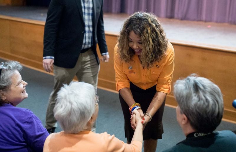 U.S. Rep. Lucy McBath, D-Marietta, greets guest before speaking at a town hall at Dunwoody High School on Saturday, June 8, 2019. (Photo: Branden Camp/Special to the AJC)
