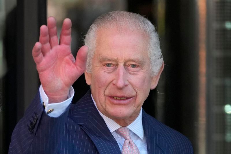 Britain's King Charles III waves as he arrives for a visit to University College Hospital Macmillan Cancer Centre in London, Tuesday, April 30, 2024. The King, Patron of Cancer Research UK and Macmillan Cancer Support, and Queen Camilla visited the University College Hospital Macmillan Cancer Centre, meeting patients and staff. This visit is to raise awareness of the importance of early diagnosis and will highlight some of the innovative research, supported by Cancer Research UK, which is taking place at the hospital. (AP Photo/Kin Cheung)