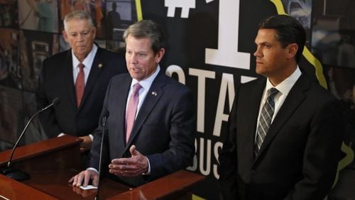 Gov. Brian Kemp, center, is flanked by Lt. Gov. Geoff Duncan, right, and House Speaker David Ralston during a press conference Monday following final passage of Senate Bill 106. Kemp said he will “very quickly” sign the bill, which would give him authority to pursue waivers from the Trump administration seeking more flexibility in the use of federal funds for health care. Bob Andres / bandres@ajc.com